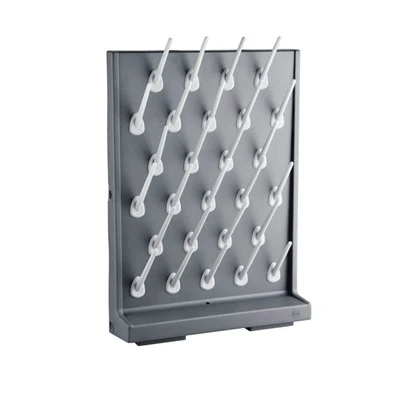 Glassware drying rack with lower drip collection channel and selected drainage outlet